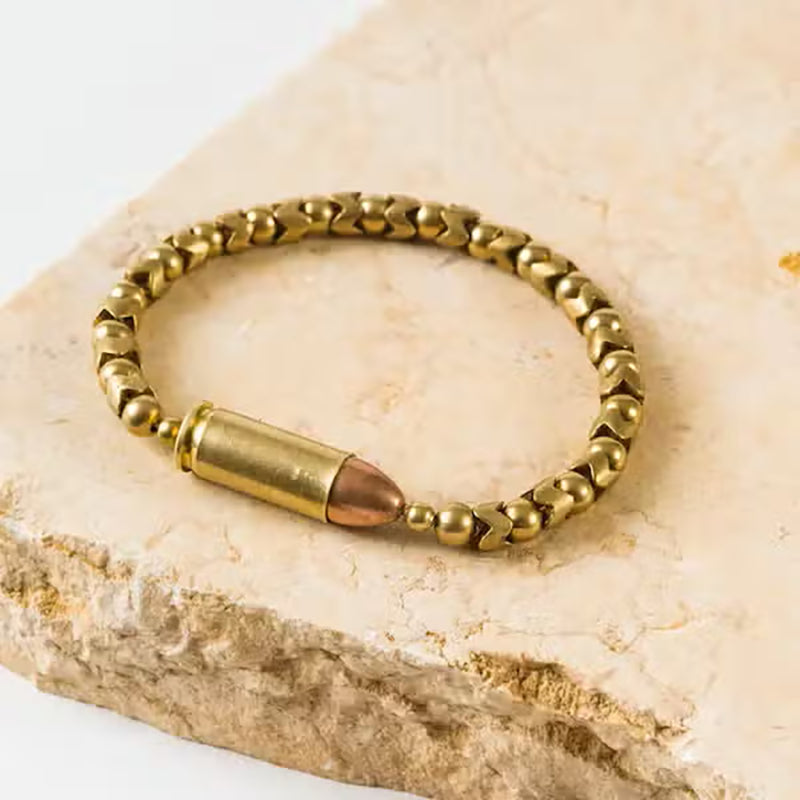 Tres Cuervos Centerfire Brass Bracelet, with real bullet closure.  uses strong stretch cord