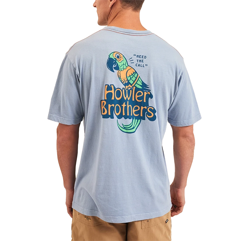 Model Wearing Howler Brothers Chatty Bird Cotton T-shirt, in dusty blue, rear  view