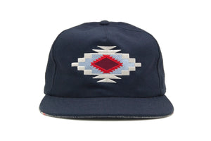 Front view of the Chimayo Wool Strapback Hat featuring Chimayo-style embroidered diamond pattern on a navy wool blend.