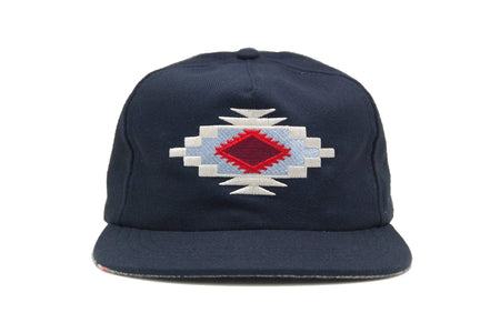 Front view of the Chimayo Wool Strapback Hat featuring Chimayo-style embroidered diamond pattern on a navy wool blend.
