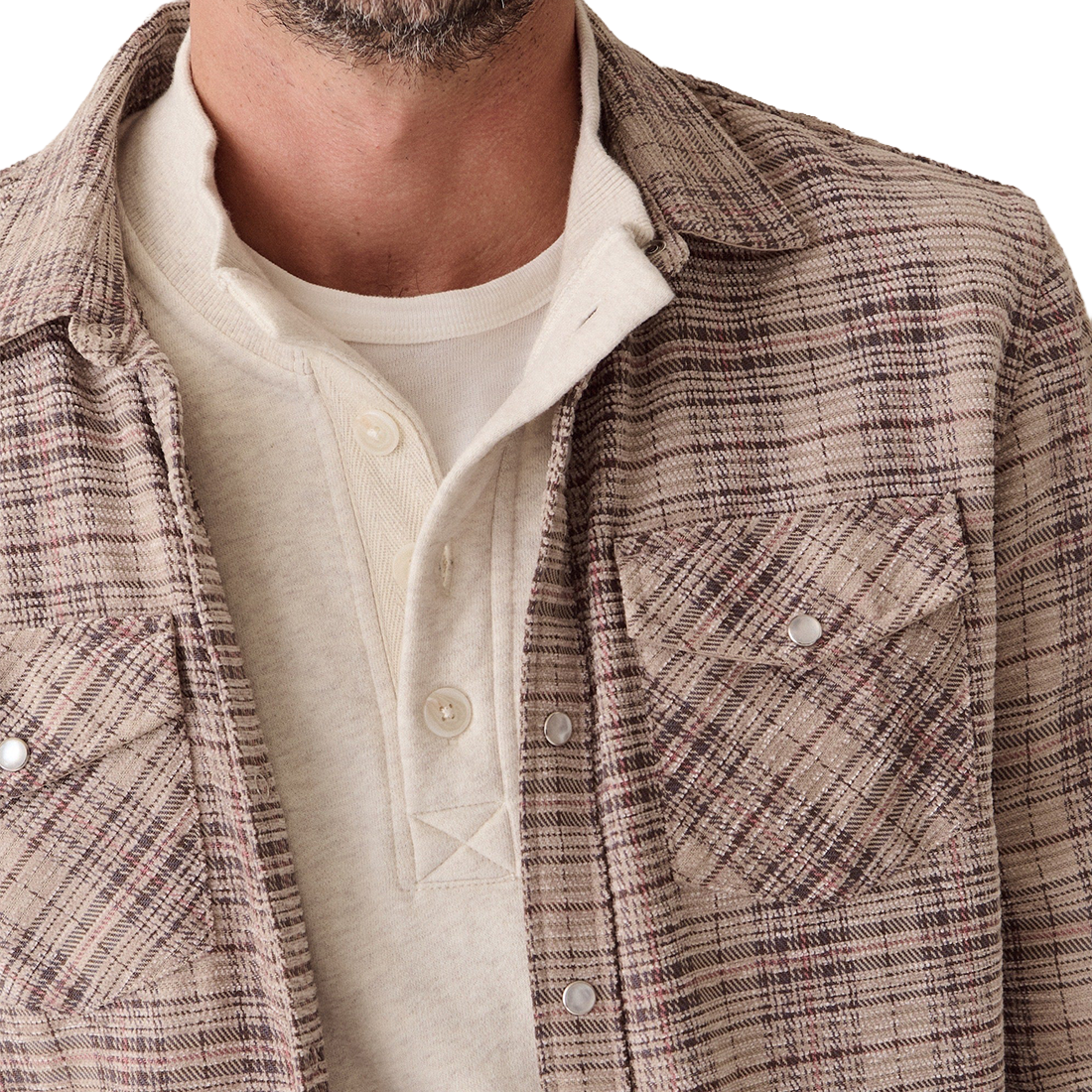 Detail of the Clark shirt's chenille cord texture, snap flap pocket and collar over a cream henley