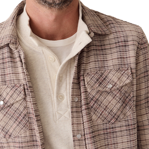 Detail of the Clark shirt's chenille cord texture, snap flap pocket and collar over a cream henley