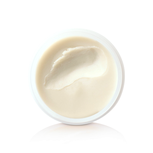 Open jar of Claymation showing the creamy clay-wax texture, top-down view