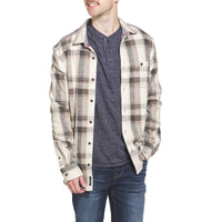 Men's Flag & Anthem Clearbrook plaid flannel shirt in cream and brown, worn open over navy henley – rugged fall style at The Simple Man