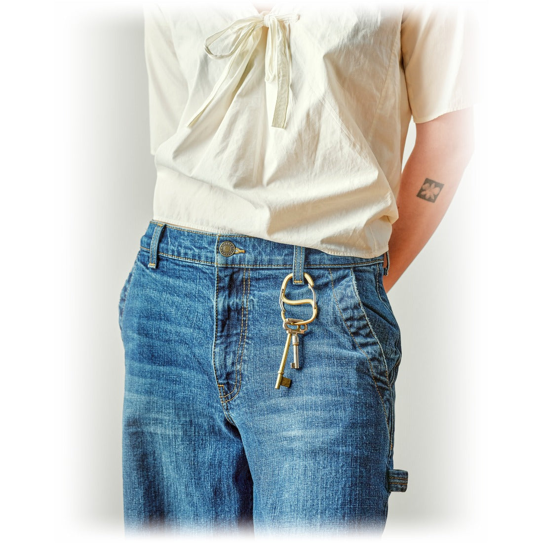 Coachwhip Carabiner on a belt loop with a key hooked on, on model - The Simple Man
