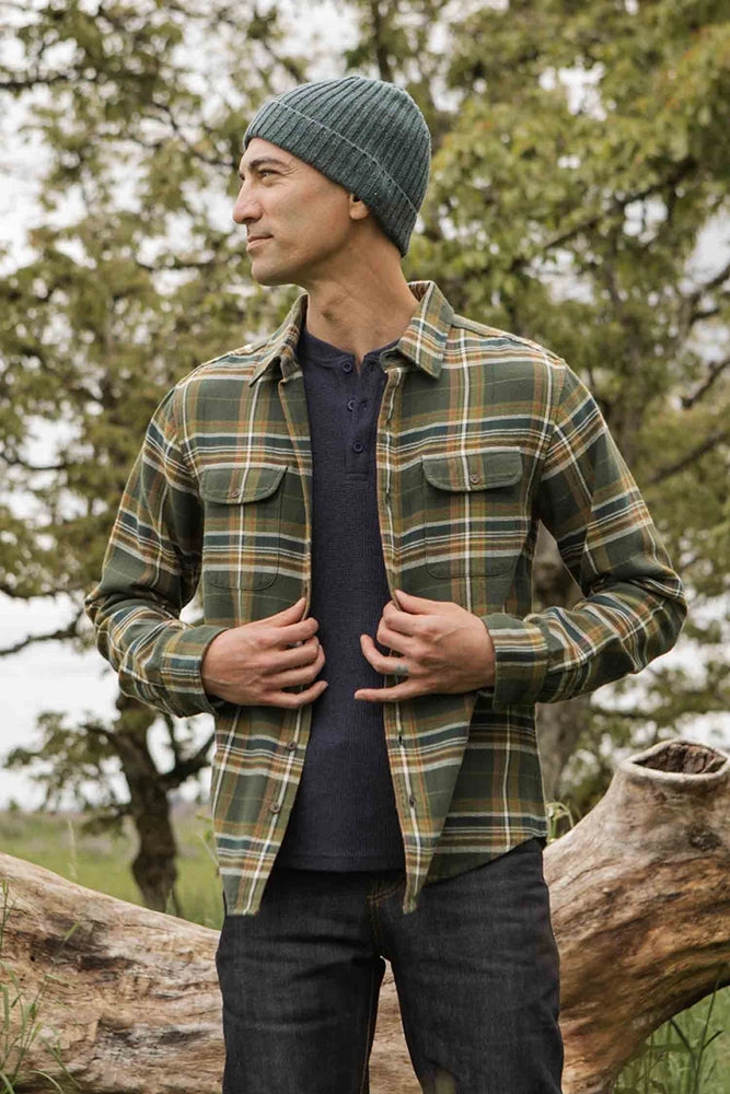 Model wearing The Cole Slim Fit Brushed Cotton Shirt in Mountain Green plaid with beanie and denim jeans in outdoor setting – casual fall outfit for men