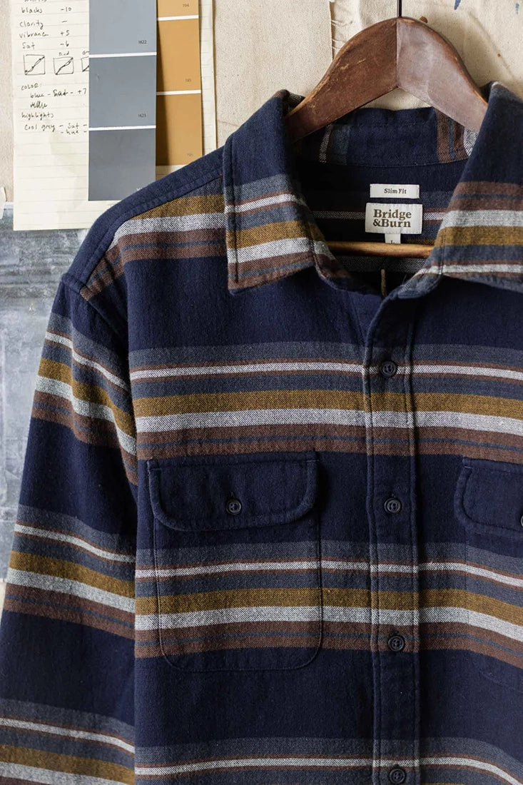 Bridge & Burn Cole Slim Shirt in Coastline Stripe – Close-up of chest pockets, navy base, and multi-color horizontal stripes – The Simple Man