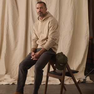 Man wearing Comfort Terry Straight Pant in Steel with a tan hoodie, lifestyle photo at The Simple Man