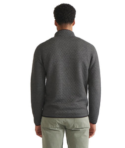 Back view of Marine Layer Reversible Corbet Pullover in charcoal quilted fabric, worn by male model