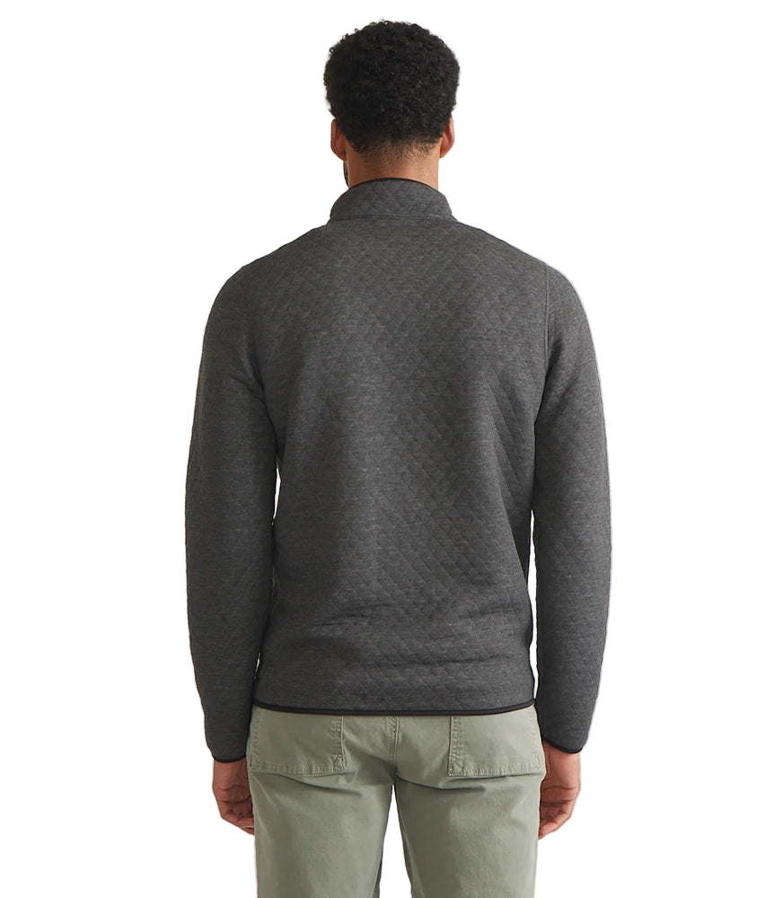 Back view of Marine Layer Reversible Corbet Pullover in charcoal quilted fabric, worn by male model