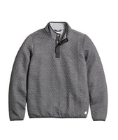 Flat lay of Marine Layer Corbet Pullover in charcoal quilted fabric, showing interior heather grey reversible lining