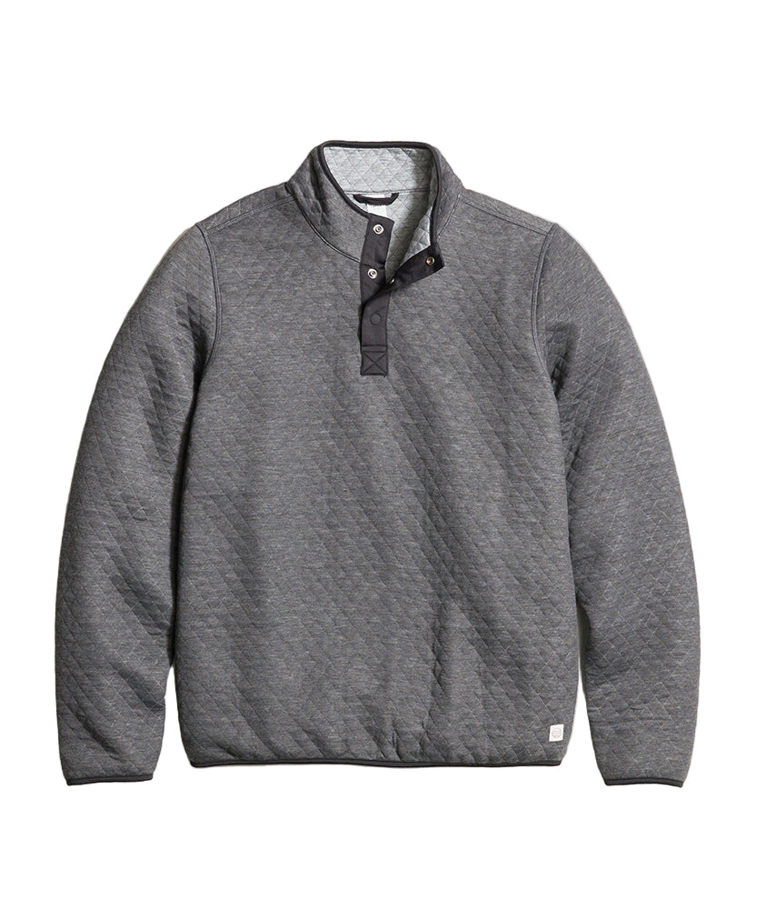 Flat lay of Marine Layer Corbet Pullover in charcoal quilted fabric, showing interior heather grey reversible lining