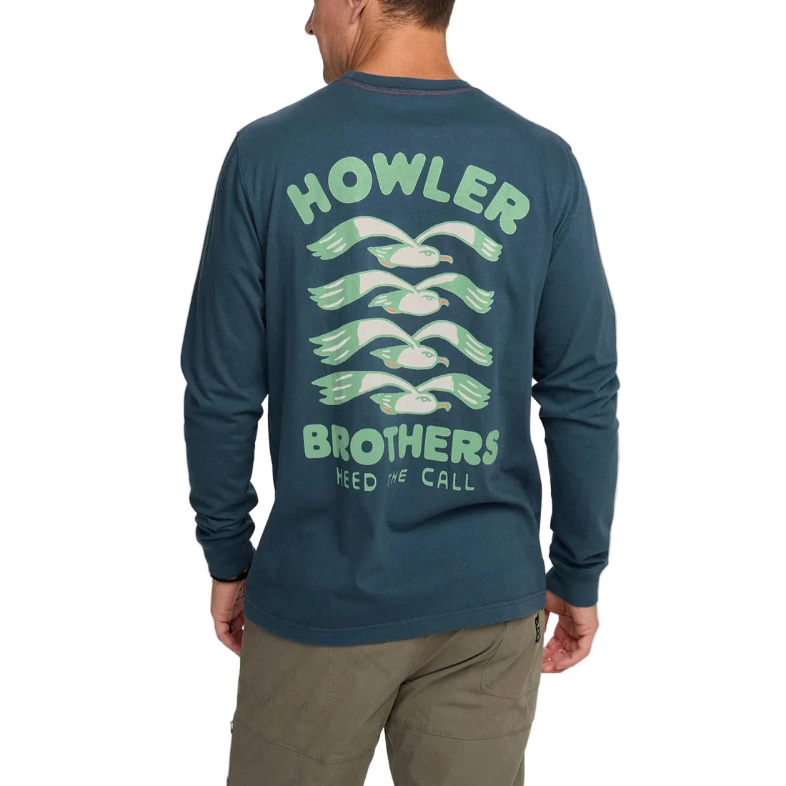 Back view of Howler Brothers Flocka Seagulls graphic long sleeve shirt with flying seagull artwork, 100% cotton, worn by male model