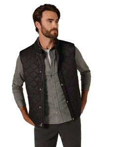Man wearing black diamond-quilted vest over gray button-down shirt – Crest Quilted Vest by The Simple Man