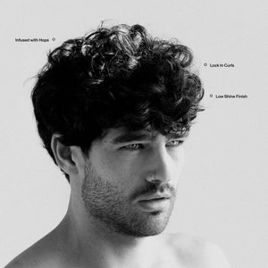Blind Barber Curl Defining Cream bottle with coconut oil, argan oil, olive oil, and hops extract ingredient callouts - The Simple Man