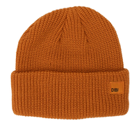 Burnt orange ribbed knit fisherman beanie with a wide folded cuff and a small woven label on a white background - The Simple Man