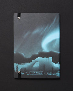Back cover of Arctic Ice Dark Analysis notebook featuring aurora borealis design and Cognitive Surplus logo