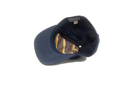 Interior of navy Danger snapback hat showing blanketstripe lining and sweatband