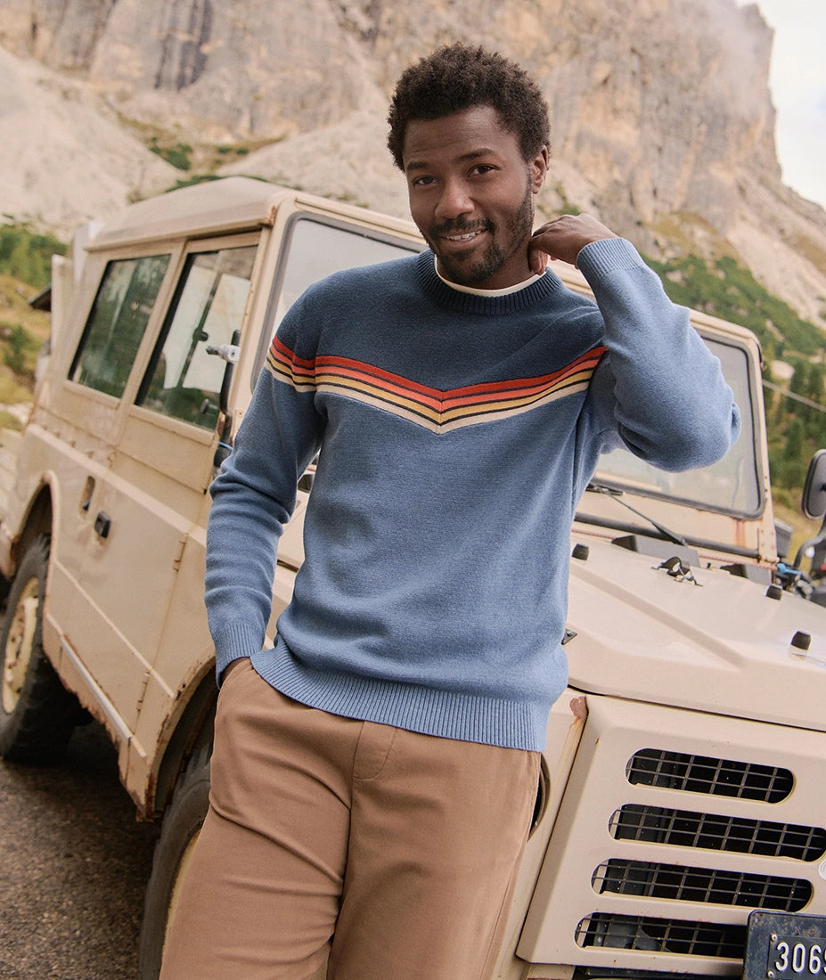 Man wearing Dean Crew Sweater navy with retro chevron stripes standing by vintage SUV – The Simple Man Omaha