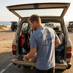 Division Tee Fog lifestyle – Jetty Supply American Dive Div back graphic worn at beach with dive gear – The Simple Man