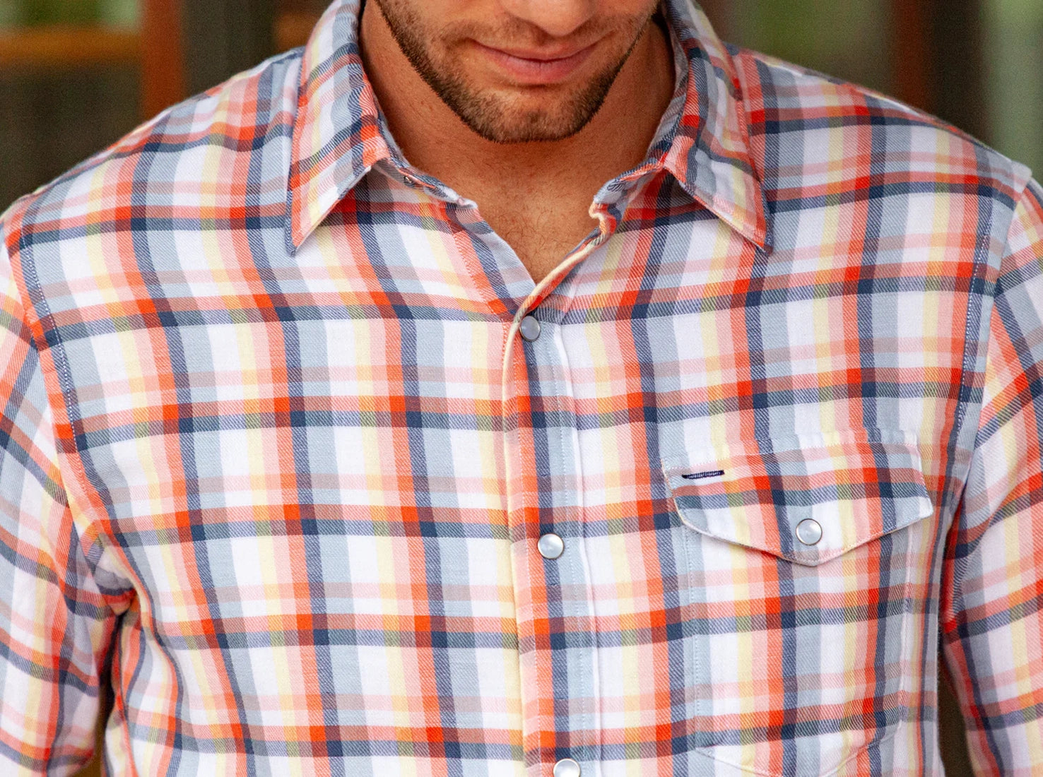 Man wearing lightweight double cloth flannel shirt in peach plaid