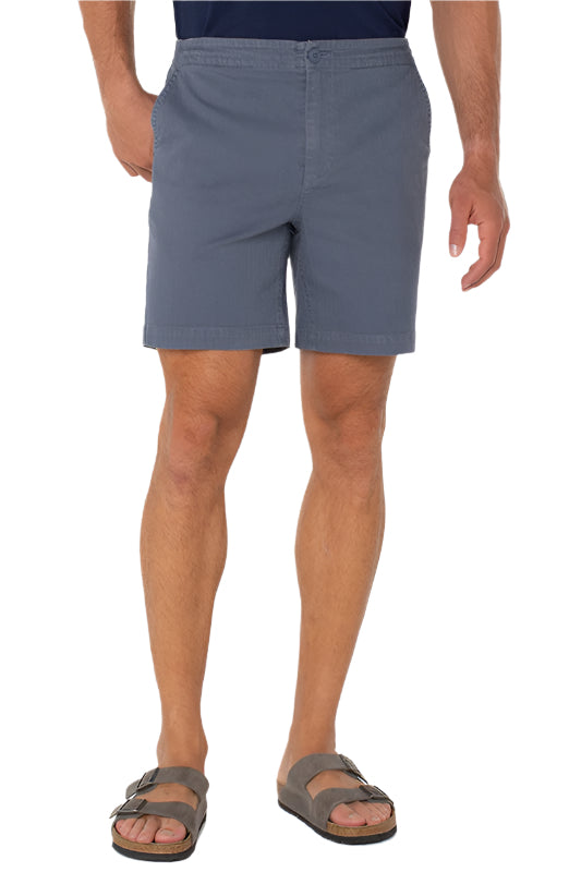 Model Wearing drawstring shorts in vintage indigo color, front view