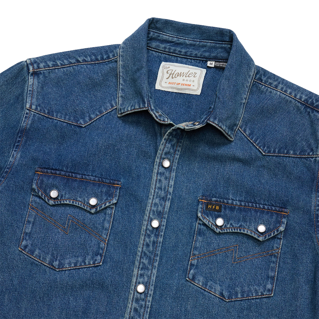 Howler Bros Dust Up Denim neck label and western collar on the Bolan Classic Wash snapshirt, detail view, The Simple Man