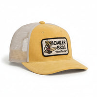 Yellow corduroy El Monito Surfs Badge Hat by Howler Brothers with embroidered front patch and white mesh back.