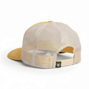 Back view of yellow corduroy Howler Brothers El Monito Surfs Badge Hat with white mesh panels and adjustable snapback.