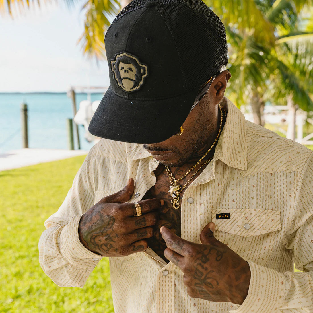 El Mono patch detail on black structured cap