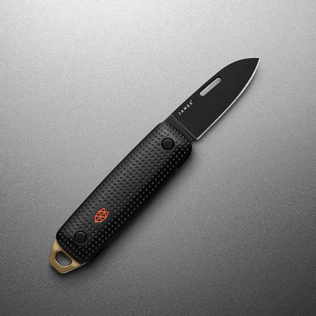The James Brand Elko Black and Fire open angle view — black blade black handle orange logo bronze end cap EDC knife, front side of knife