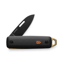 The James Brand Elko slip joint knife open white background — Black and Fire variant black blade orange logo bronze key ring

