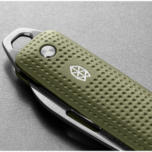 The James Brand Elko knife Grove colorway close-up — machined aluminum handle dot texture and stainless logo detail