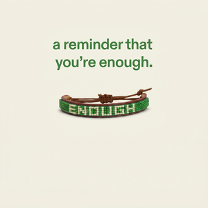 We Are Enough ENOUGH Beaded Leather Bracelet single worn on wrist showing adjustable sliding knot