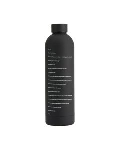 We Are Enough ENOUGH Insulated Water Bottle Real Black lifestyle shot showing 24 oz matte finish