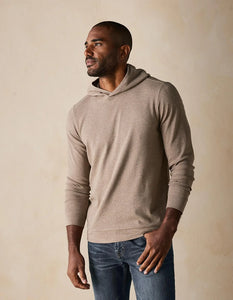 Side front view of Puremeso taupe hoodie on male model – modern, drawcord-free hoodie made with soft Puremeso fabric from The Normal Brand.