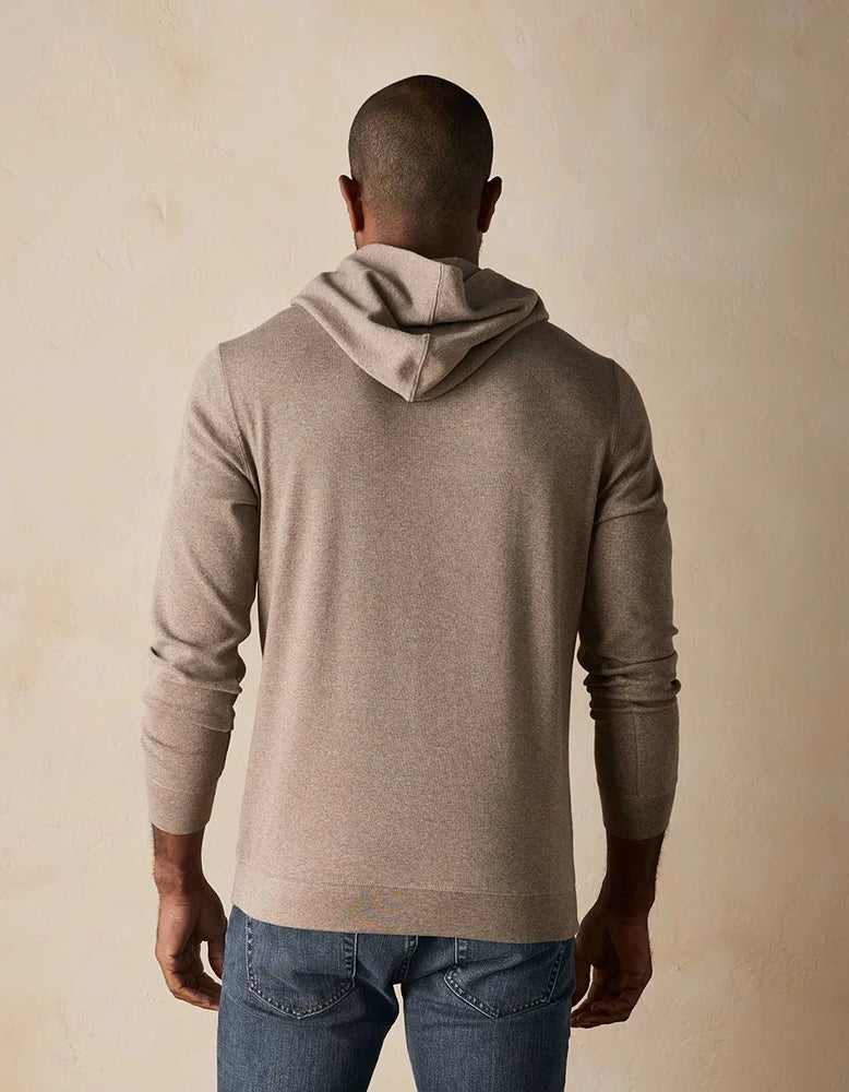 Back view of man wearing Puremeso Essential Hoodie in taupe – comfortable men's hoodie by The Normal Brand, available at The Simple Man in Omaha.