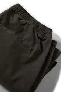 Back view of black relaxed-fit twill shorts with welt pocket and stretch waistband
