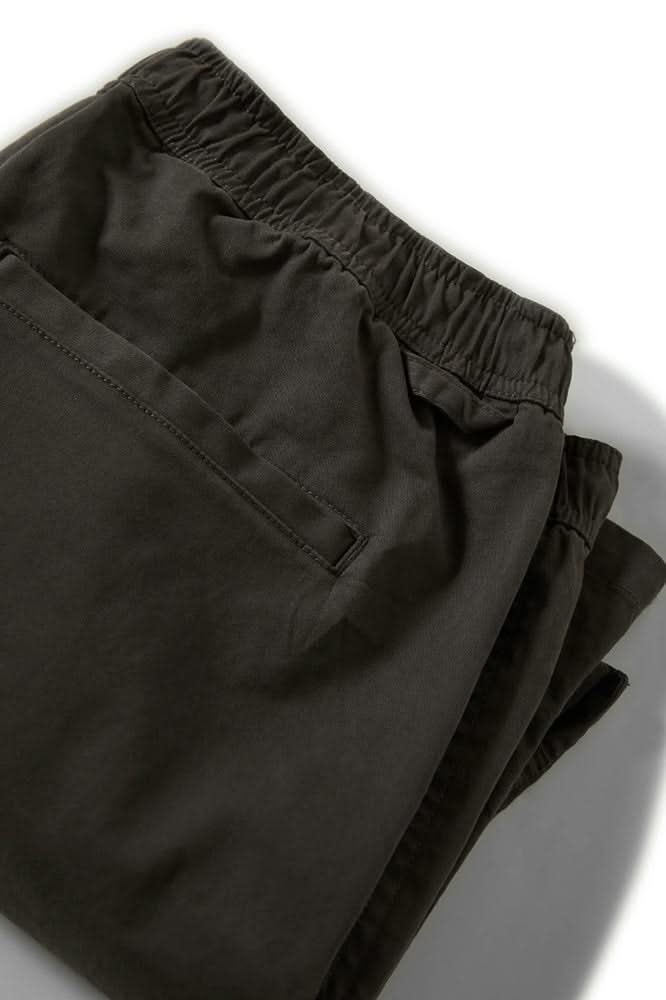 Back view of black relaxed-fit twill shorts with welt pocket and stretch waistband

