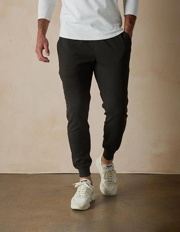 Model Wearing The Normal Brand Everyday Jogger in Charcoal, front view