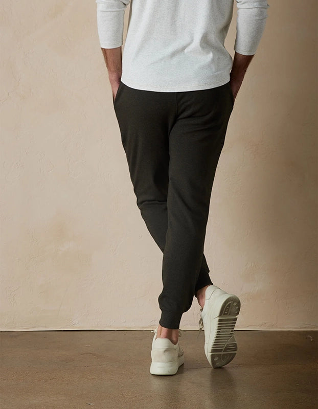 Model Wearing The Normal Brand Everyday Jogger in Charcoal, rear view