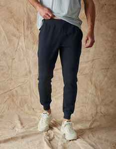 Model Wearing The Normal Brand Everyday Jogger in Navy, front view