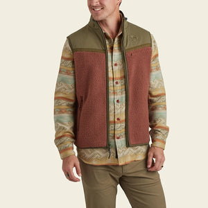 model wearing Howler Brothers Crozet Fleece vest in cherrywood / Olive, front view