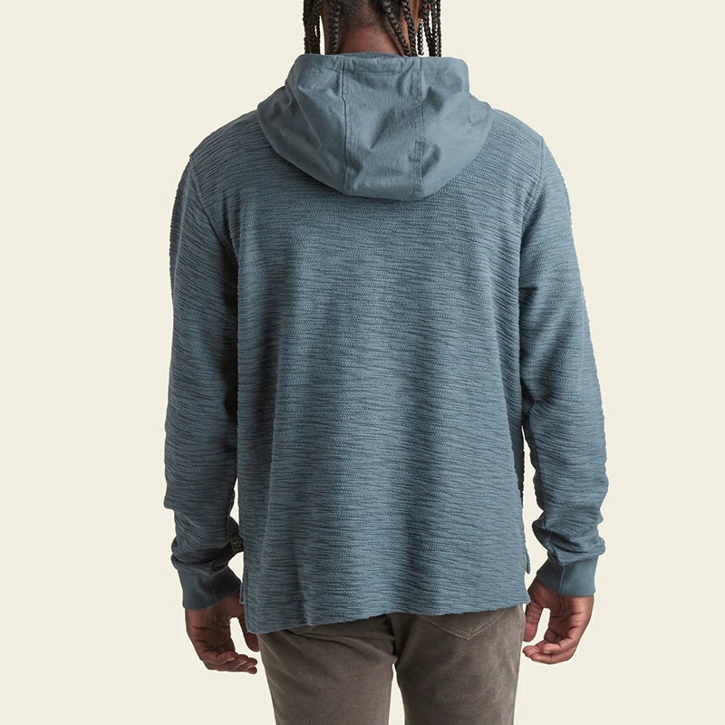 model wearing Howler Bros Honzer Hoodie in admiralty Blue, rear view