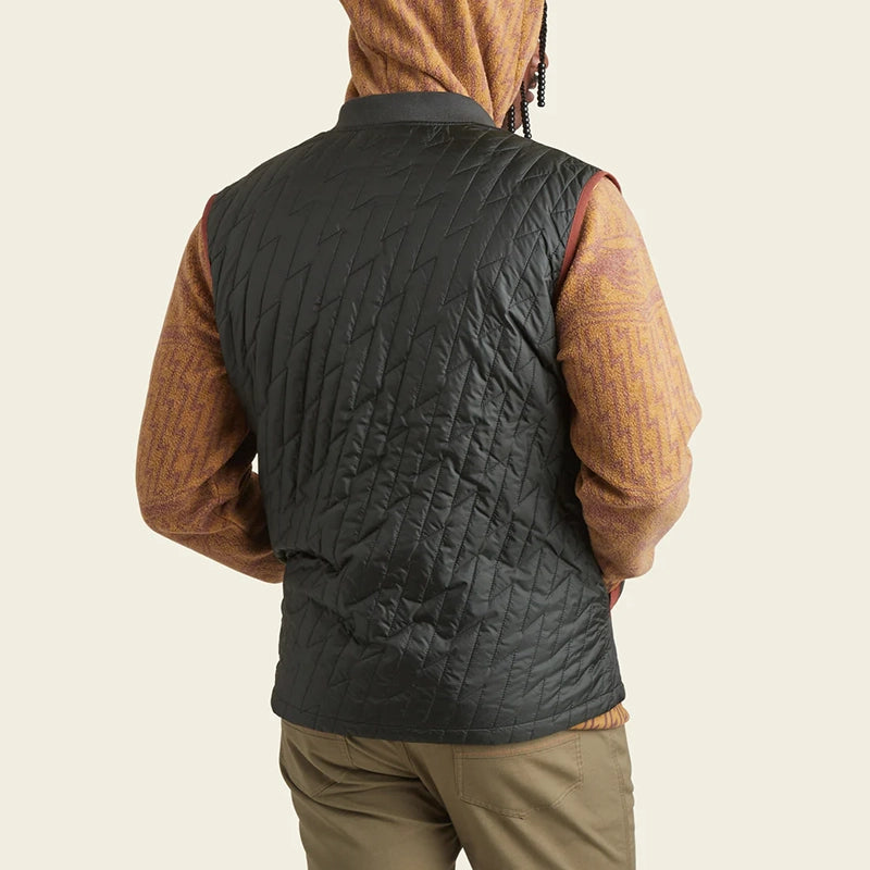 Model Wearing Howler Brothers Voltage quilted Vest in antique Black, rear view