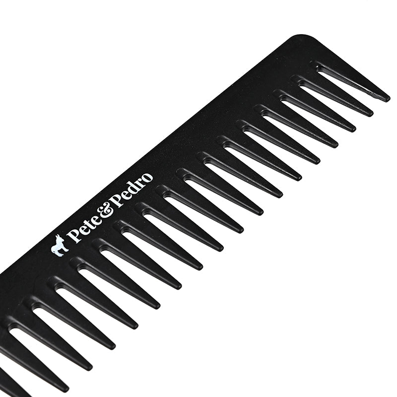 Close-up of wide tooth detangling comb teeth and logo
