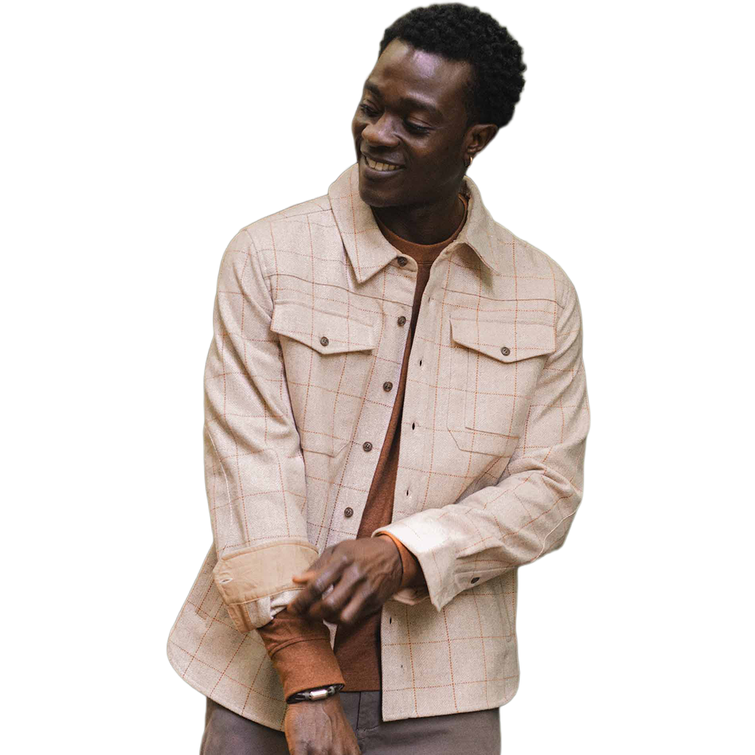 Man smiling in Fielding Shirt Jacket Stonecross, close-up on cuff detail and tan windowpane pattern - The Simple Man