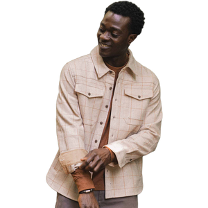 Man smiling in Fielding Shirt Jacket Stonecross, close-up on cuff detail and tan windowpane pattern - The Simple Man