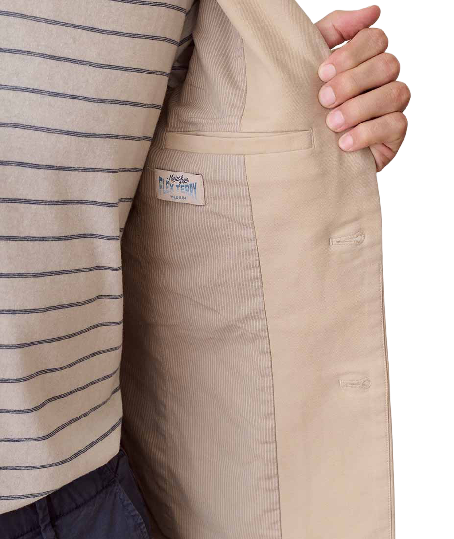 Close-up of Flex Terry Blazer interior tag reading Marine Layer Flex Terry, showing lining and pocket detail - The Simple Man