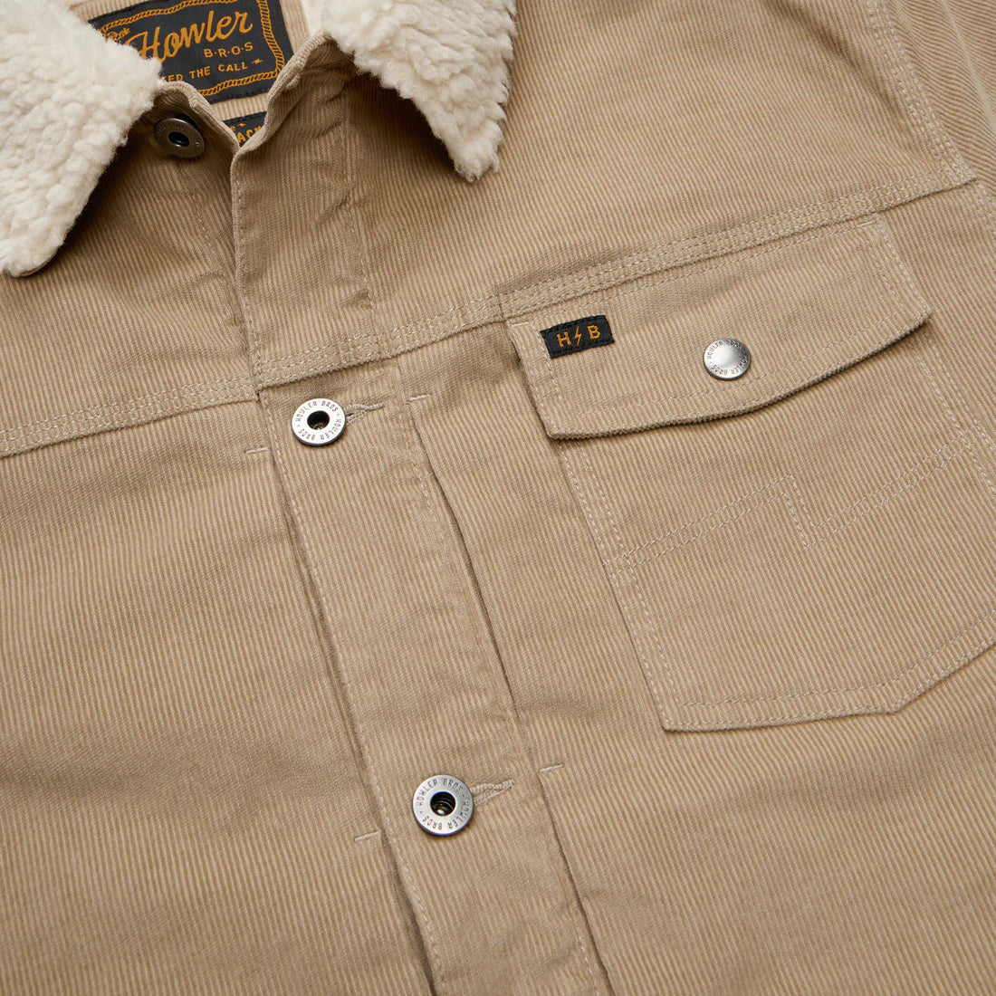 Close-up of Howler Brothers Fuzzy Depot Jacket – Putty corduroy fabric, snap chest pocket, and fleece sherpa collar – The Simple Man